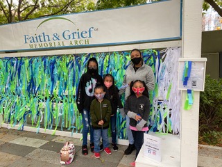 Faith & Grief Memorial Arch family visit mask